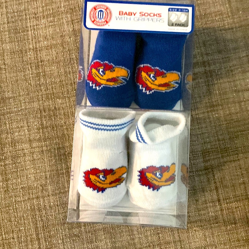 University of Kansas 0-12 month baby socks with grippers. New in the box
